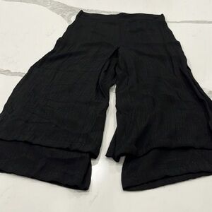 black light weight pants with slit and‎ buttons on the side.